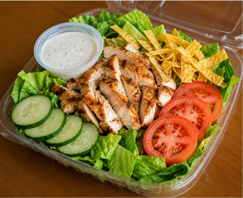 Sliced grilled chicken over romaine with cucumber, tomato, tortilla strips and a side of dressing.