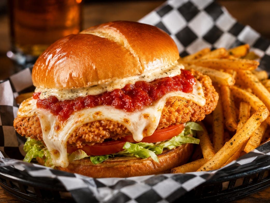 The Italian Don chicken sandwich under marinara and melted mozzarella, served with fries.