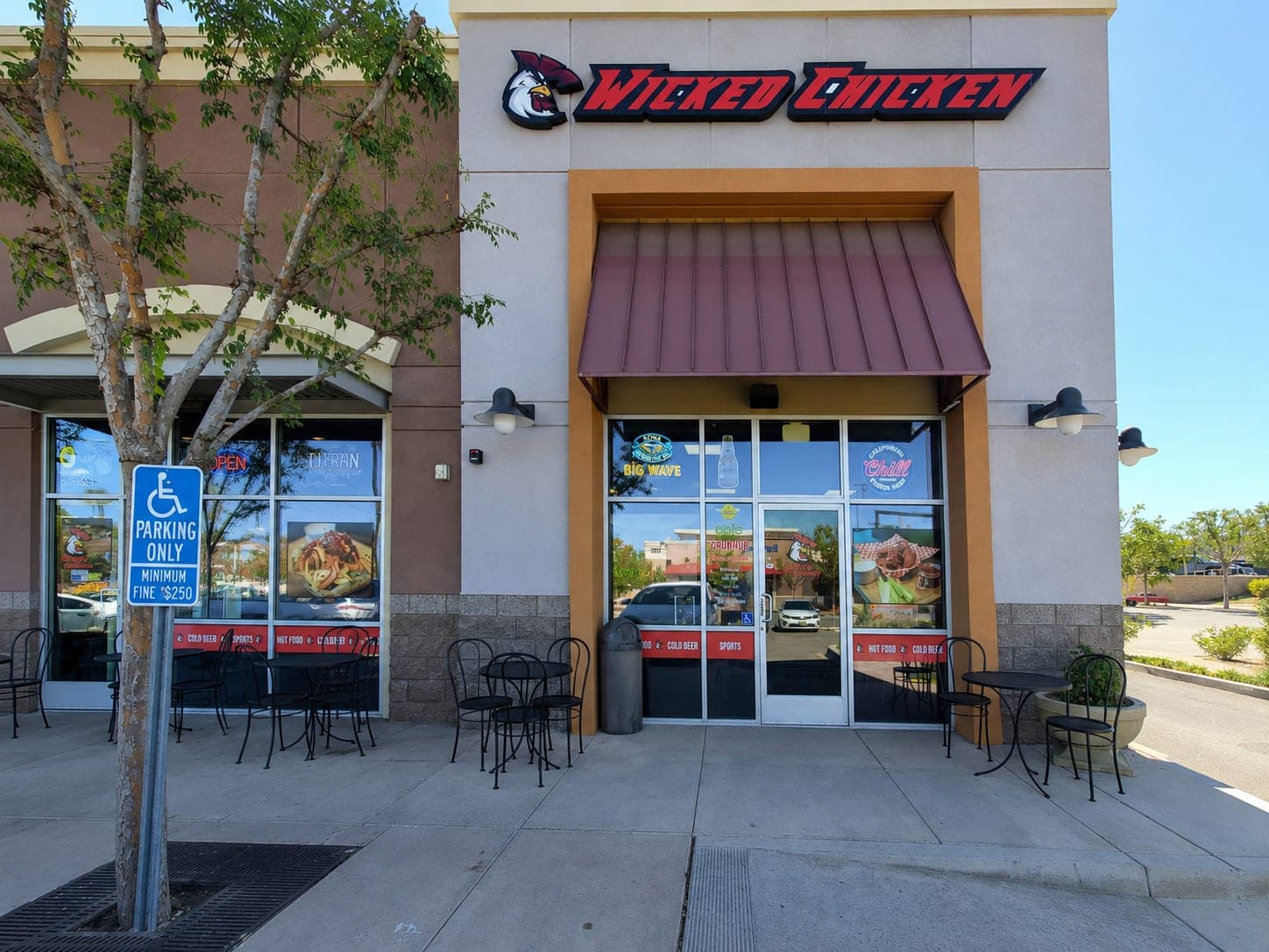 The storefront and patio tables on Golden Valley Rd in daylight.